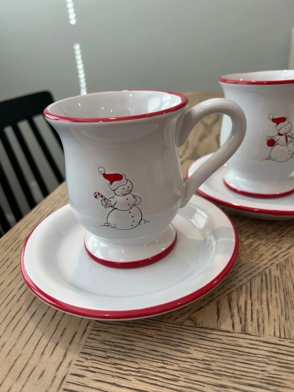 Williams Sonoma White Mugs and dessert plates with Red-Rim Snowman Motif